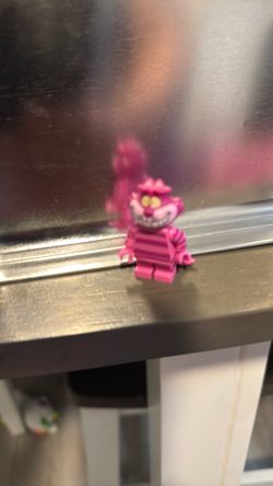 Disney Alice in Wonderland Cheshire cat lego figure on the couch