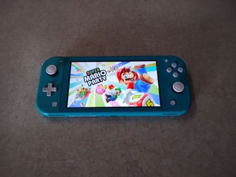 NINTENDO SWITCH LITE with 7500 GAMES INSTALLED
