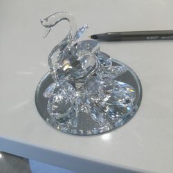 Three Glass Swan Family On A Mirror