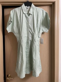 Brand new women’s size small adorable light green striped dress with pockets. 