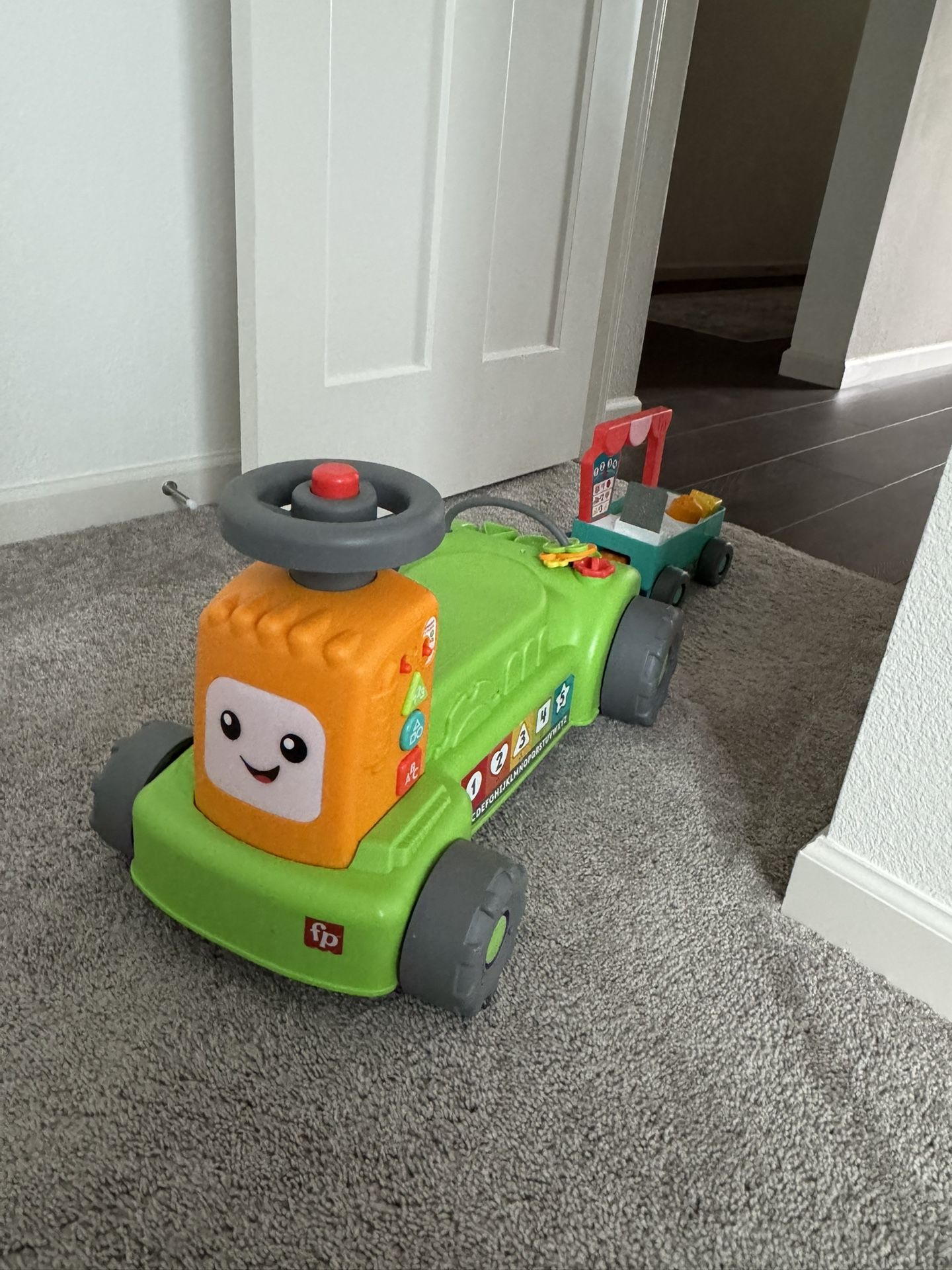 Fisher-Price Laugh & Learn 4-in-1 Farm to Market Tractor Ride-On Learning Toy for Baby & Toddlers