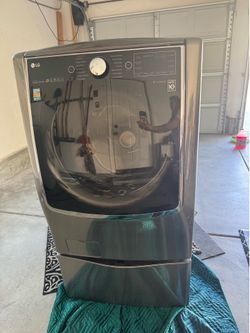 LG Front Load Washer with Steam and Turbo Wash. includes side kick pedestal