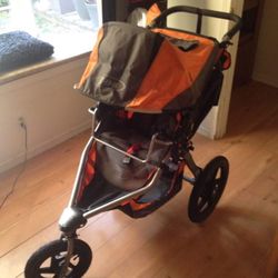 Orange And Black BOB Revolution Stroller