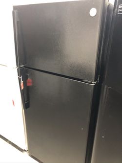 Used GE top and bottom fridge. 1 year warranty