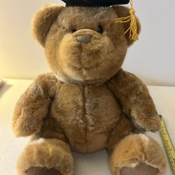 Graduation stuffed brown teddy bear.
