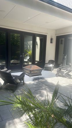 4 Adirondack chairs, fire pit with cover and new rug  (won’t separate)