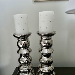 Two Silver Candle Holders with Decorative Candles