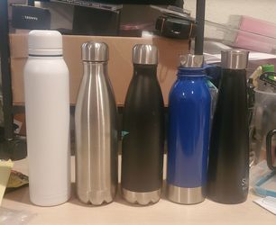New and never used stainless steel water travel bottles