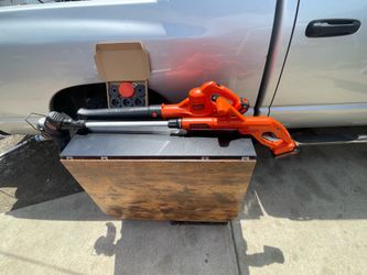 Two piece Black & Decker weedeater and leaf blower battery charger included