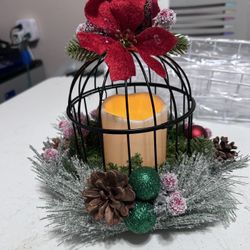 Decorated Christmas black birdcage with candle
