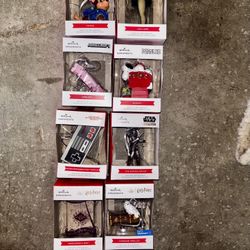 collection of Hallmark Christmas tree ornaments, featuring various pop culture and classic themes