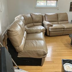 Three piece Italian leather sectional with folding leg support