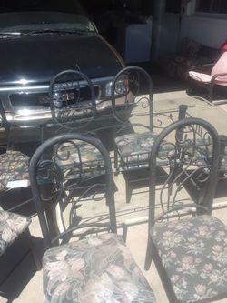 metal table and 7 chairs glass top $150.00