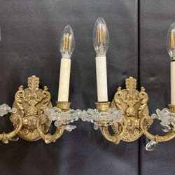 Pair of vintage antique ornate brass  two-light wall sconces, in a French Rococo or Empire style