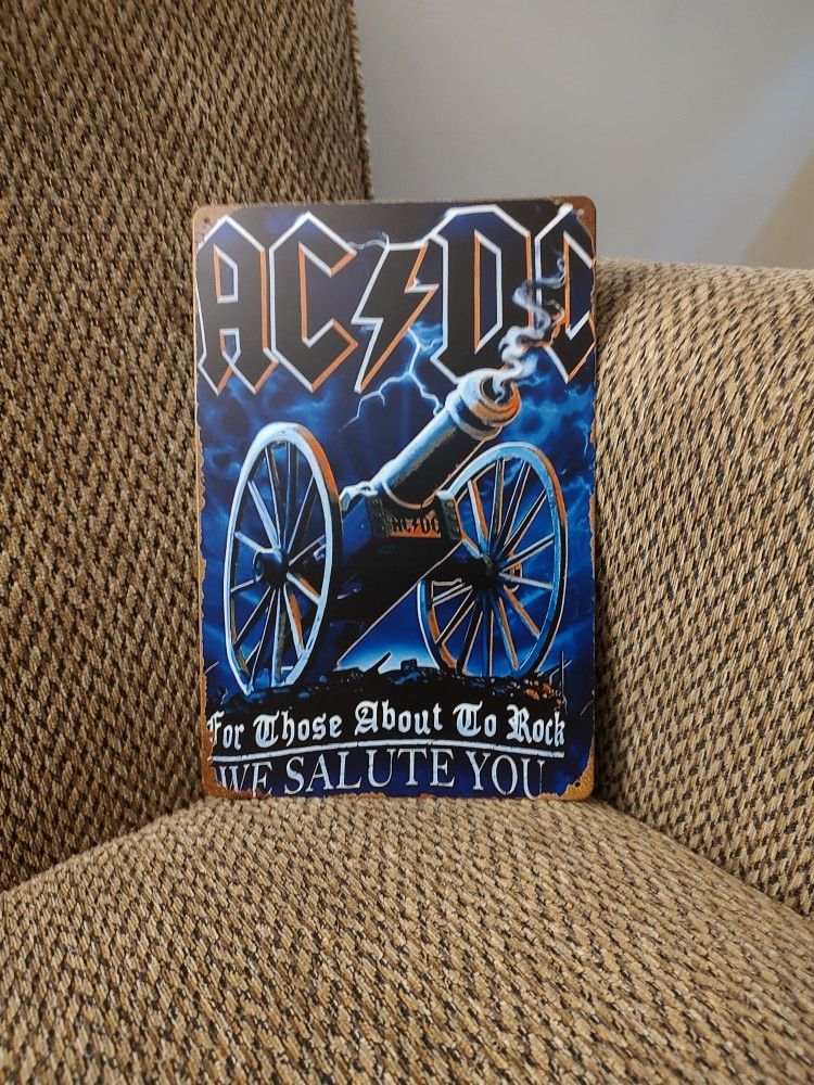 AC DC METAL SIGN.  12" X 8"  NEW. PICKUP ONLY