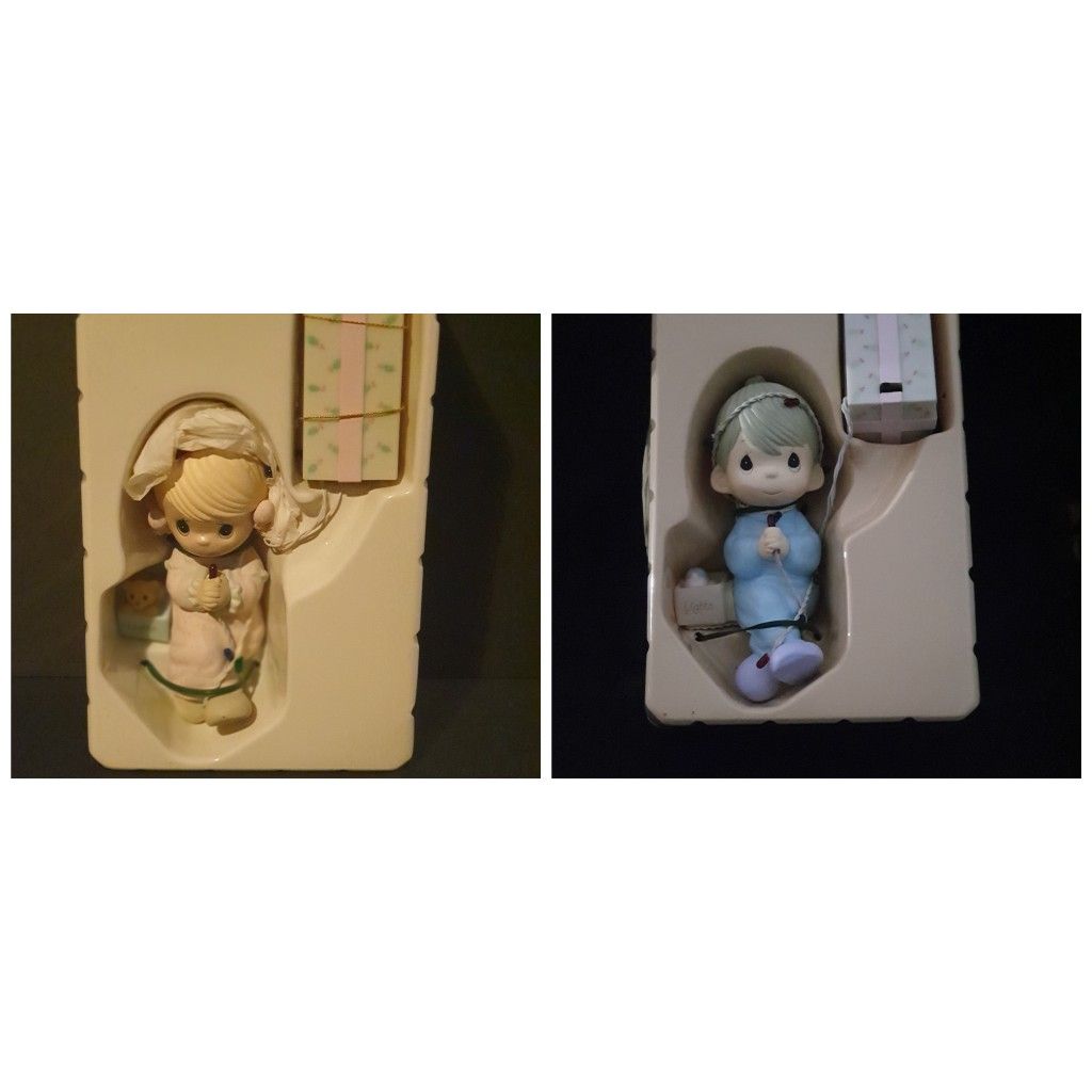 Precious Moments stocking hanger with lights. Boy and girl.