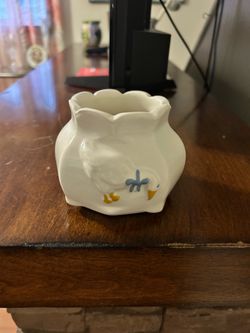 Vintage white ceramic duck-shaped egg cup