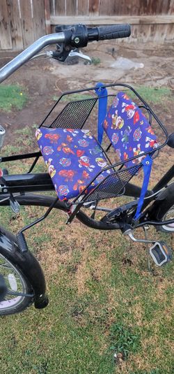 Dog seat for bikes has strap