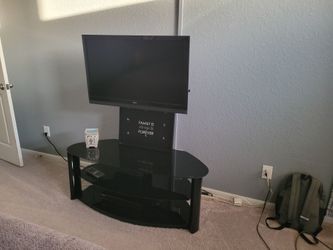 Vizio tv and black glass stand