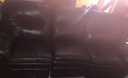 Brown leather sofa and love seat with recliners