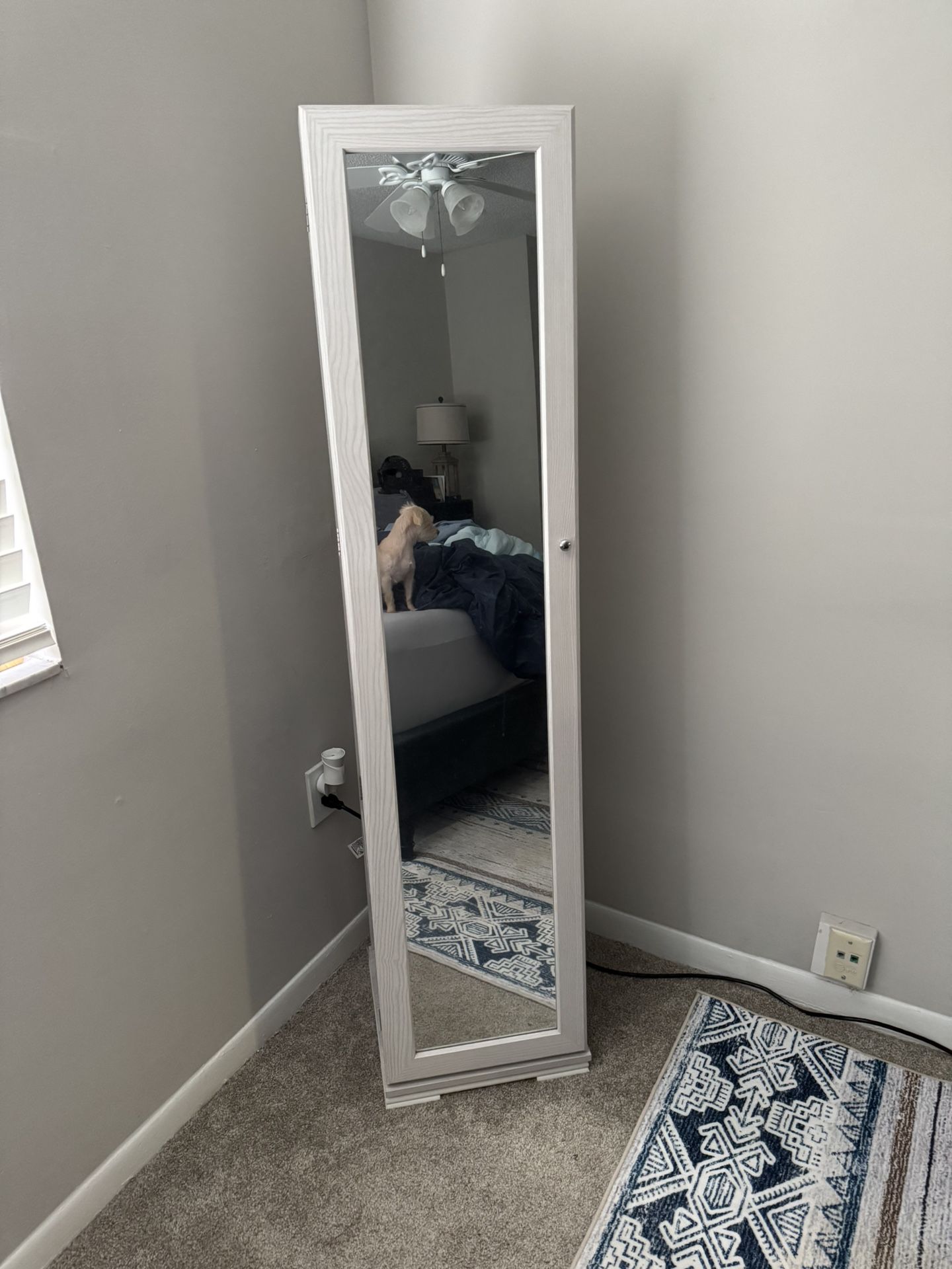 White 360 degree rotating jewelry cabinet with full length mirror