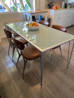 Modern IKEA Glass-Top Dining Table with Metal Legs