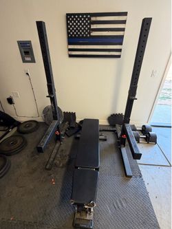 Rogue Monster Lite squat rack and bumper plates