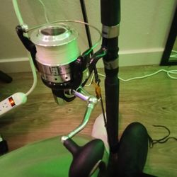 Fishing Poles And Box Of Supplies 