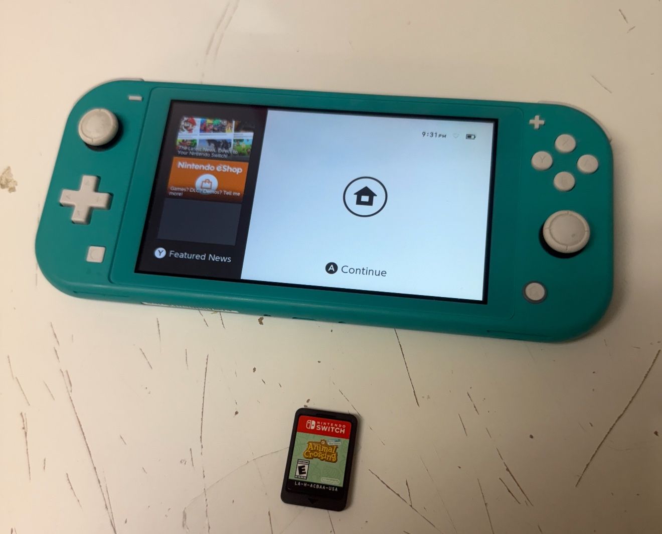 nintendo switch lite with animal crossing game