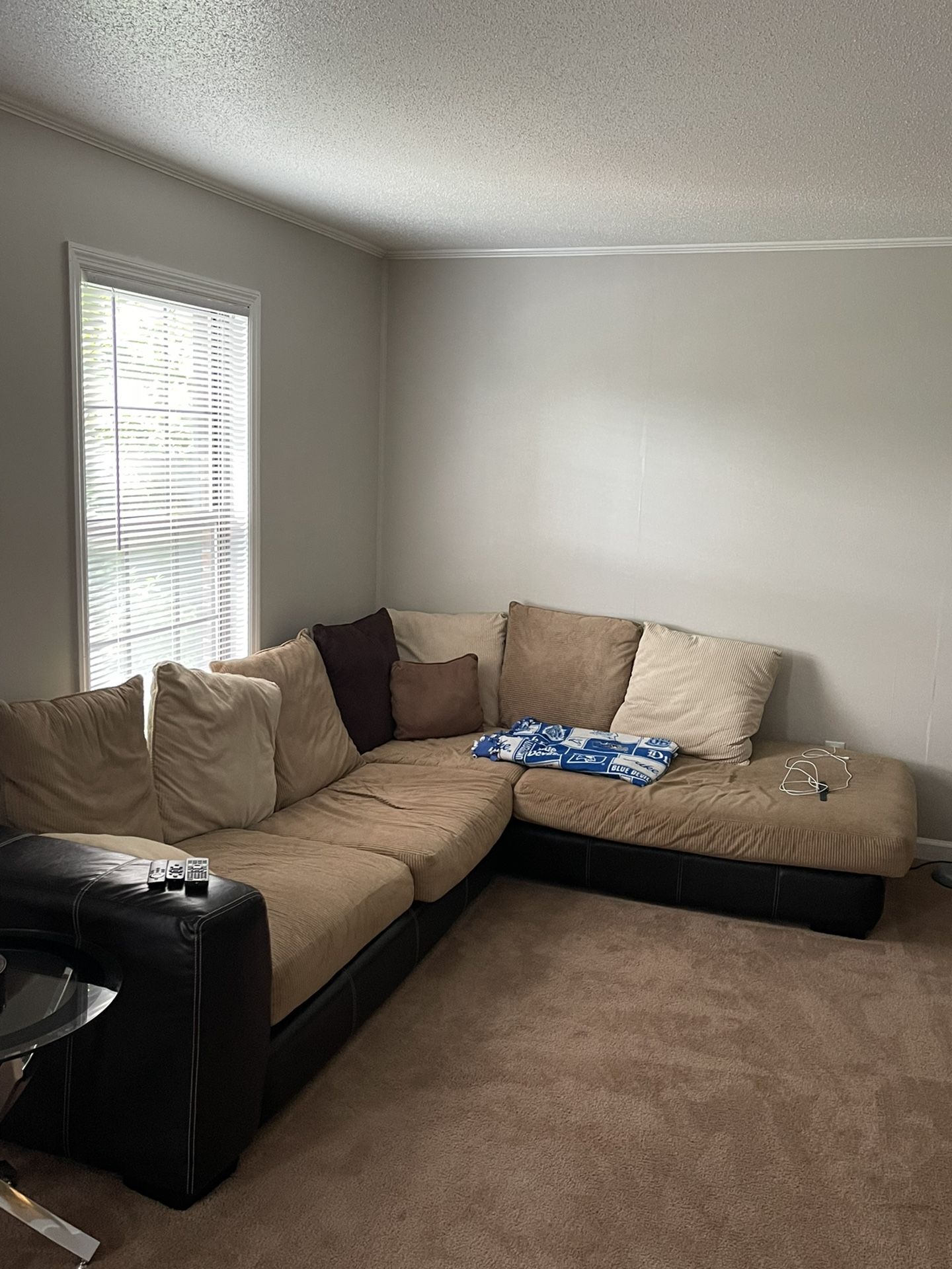 Brown Sectional Couch With Two Glass End Tables 