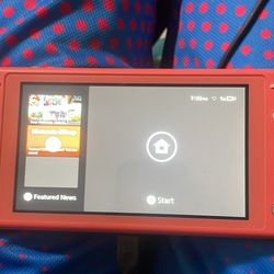 Nintendo Switch Lite handheld console in the Coral color