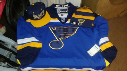 Brand new Reebok Blues Jersey with matching hats