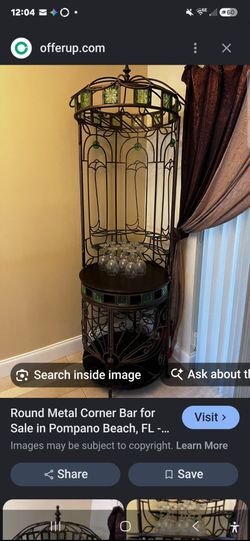 Vintage wrought iron birdcage-style wine rack and dry bar cabinet.