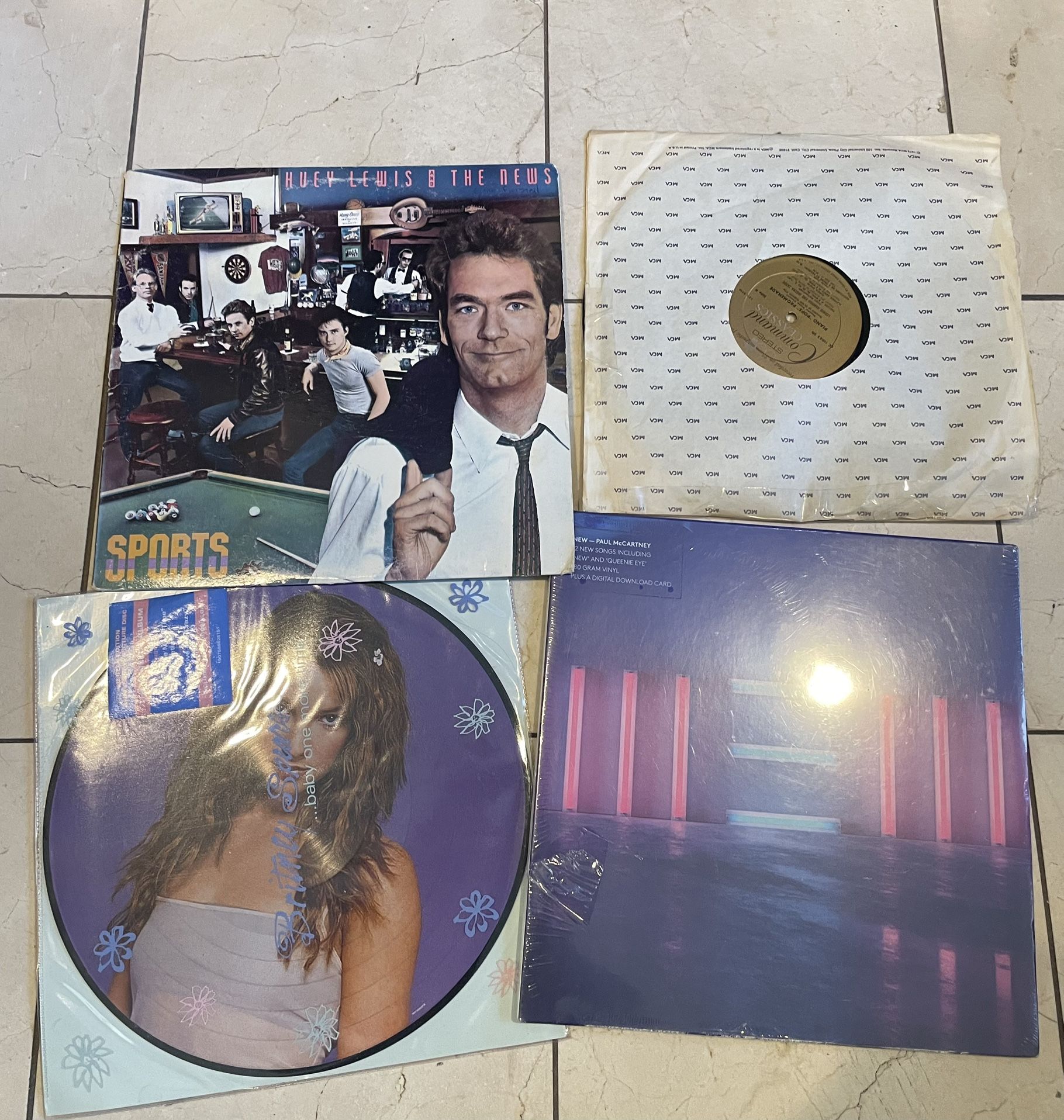 45 Lp records. Paul Mccartney huey lewis Britney spears Piano pop promenade read post