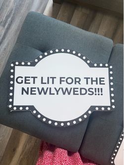 Get lit for the newlyweds sign