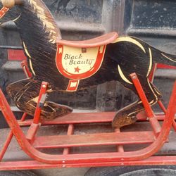 I'm selling an antique wooden rocking horse. For collectors, make an offer. 