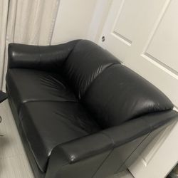Black faux leather loveseat