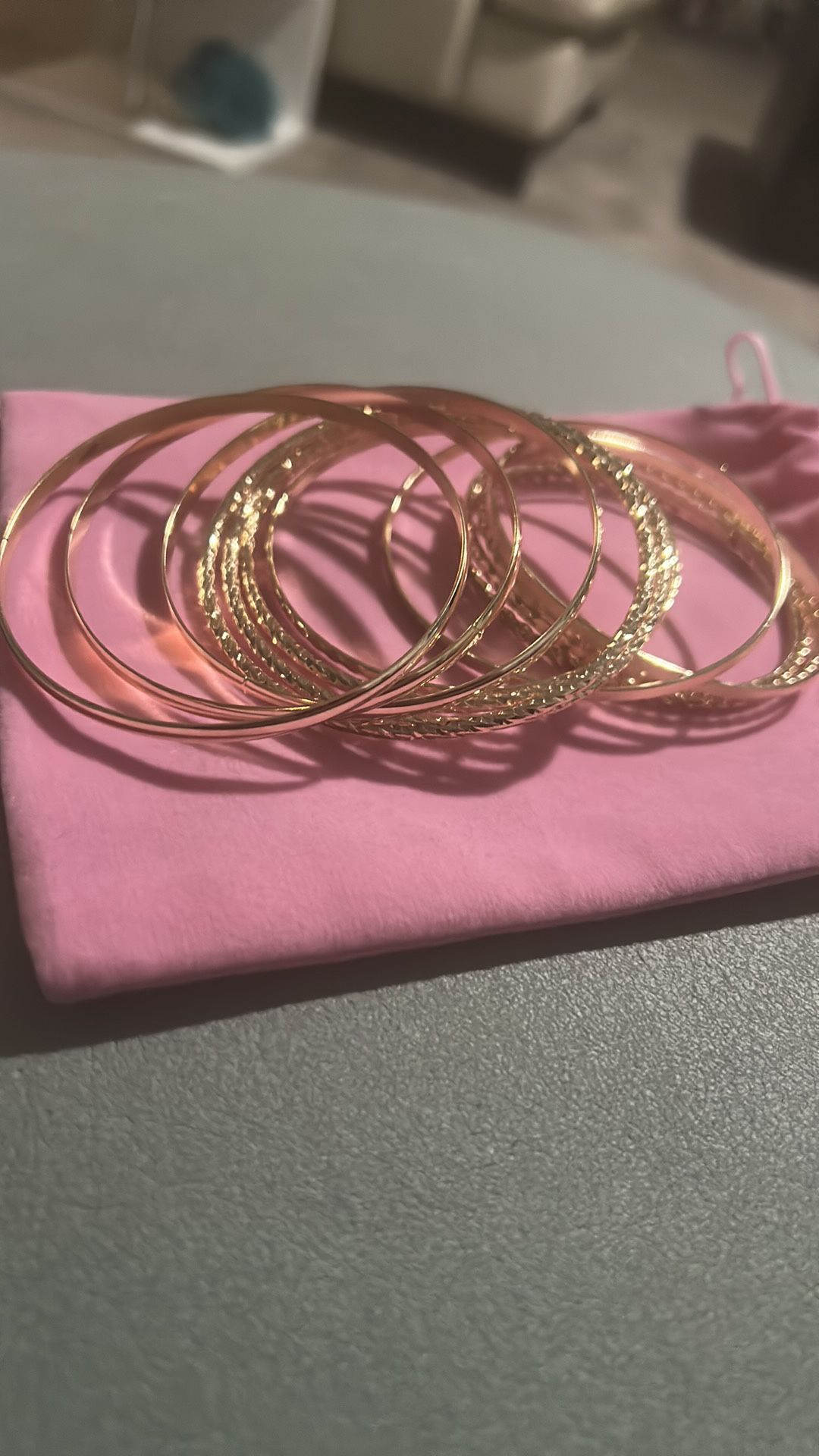 Enhance your style with this elegant gold bangle set. Perfect for any occasion, these bangles add a touch of sophistication to your outfit.