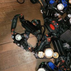 Lot Of Headlights Only. Needs Batteries And Chargers