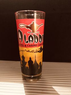 Never used Tall Aladdin Hotel & Casino Las Vegas Shot Glass ( Aladdin no longer exists)
