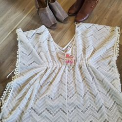 3 piece women's lot includes 2 pairs of boots/shoes from American Eagle and Lucky Brand, and 1 pair of swim cover up that is brand new with tag (NWT).