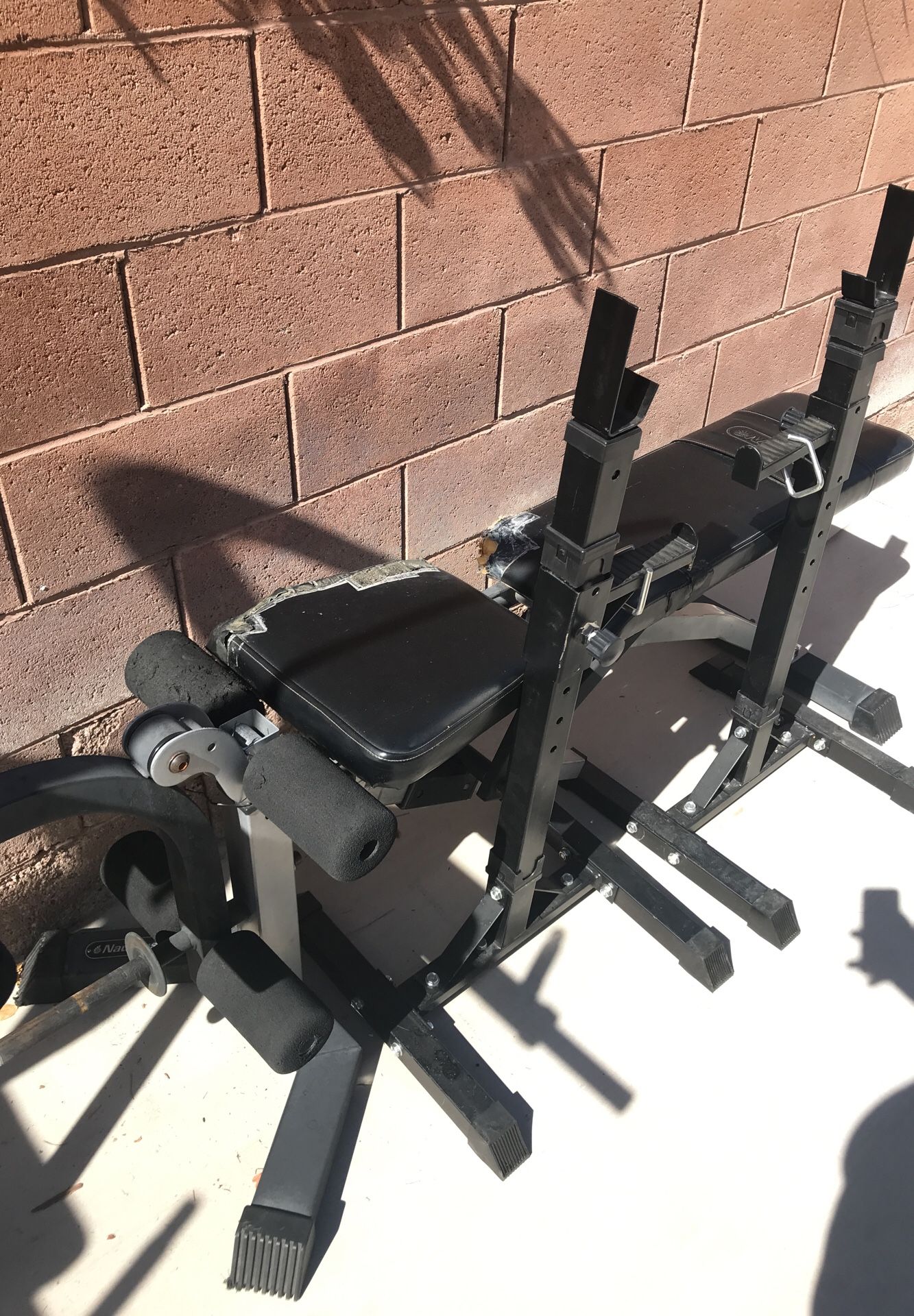 Nautilus bench and bench press and squat bar holder