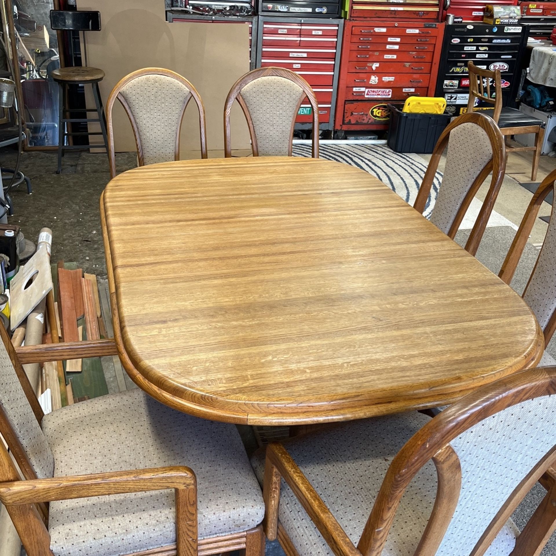 Solid oak dining room table with six chairs