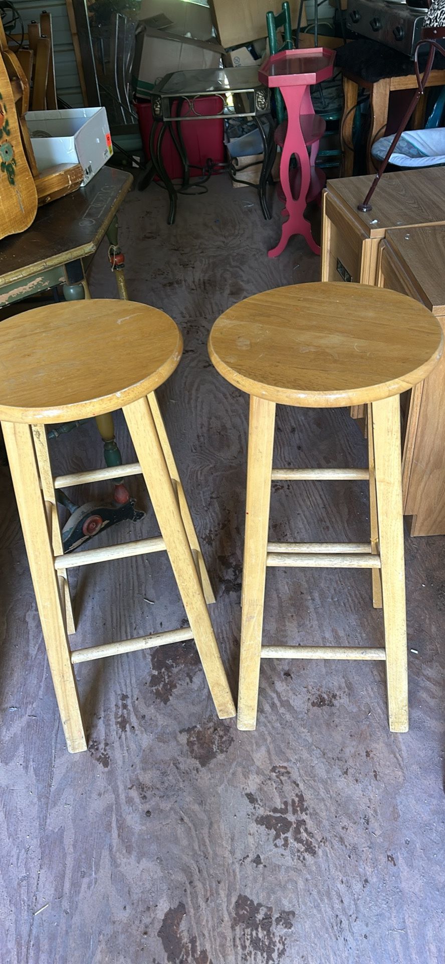 a pair of wood barsstools 30 inches tall