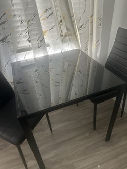 Dining table with two chairs
