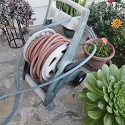 Suncast  mobile  cart & hose  good condition  H 37" x W 27" x D 20" hose  including  .