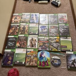 Xbox 360 console with two controllers , “tv” remote and 26 games!!!