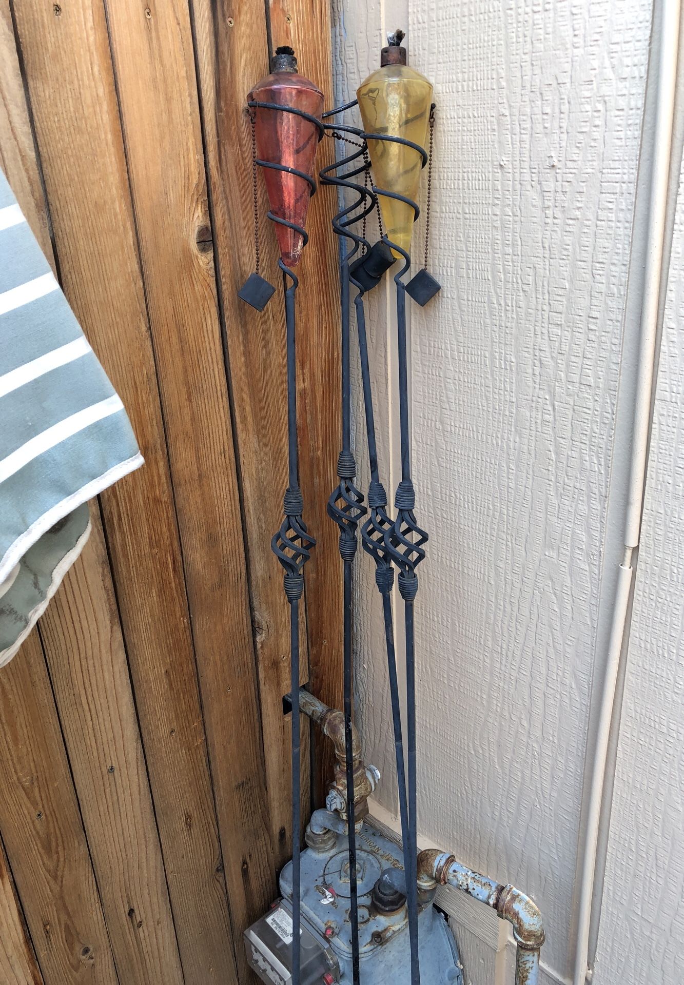Ace hardware citronella tiki torches- retail at $45 each. 4 Wrought iron stands and 2 glass containers.