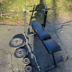 180 pounds 1” plates weights, bench and two bars