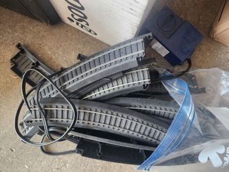 Toy train track with motor
